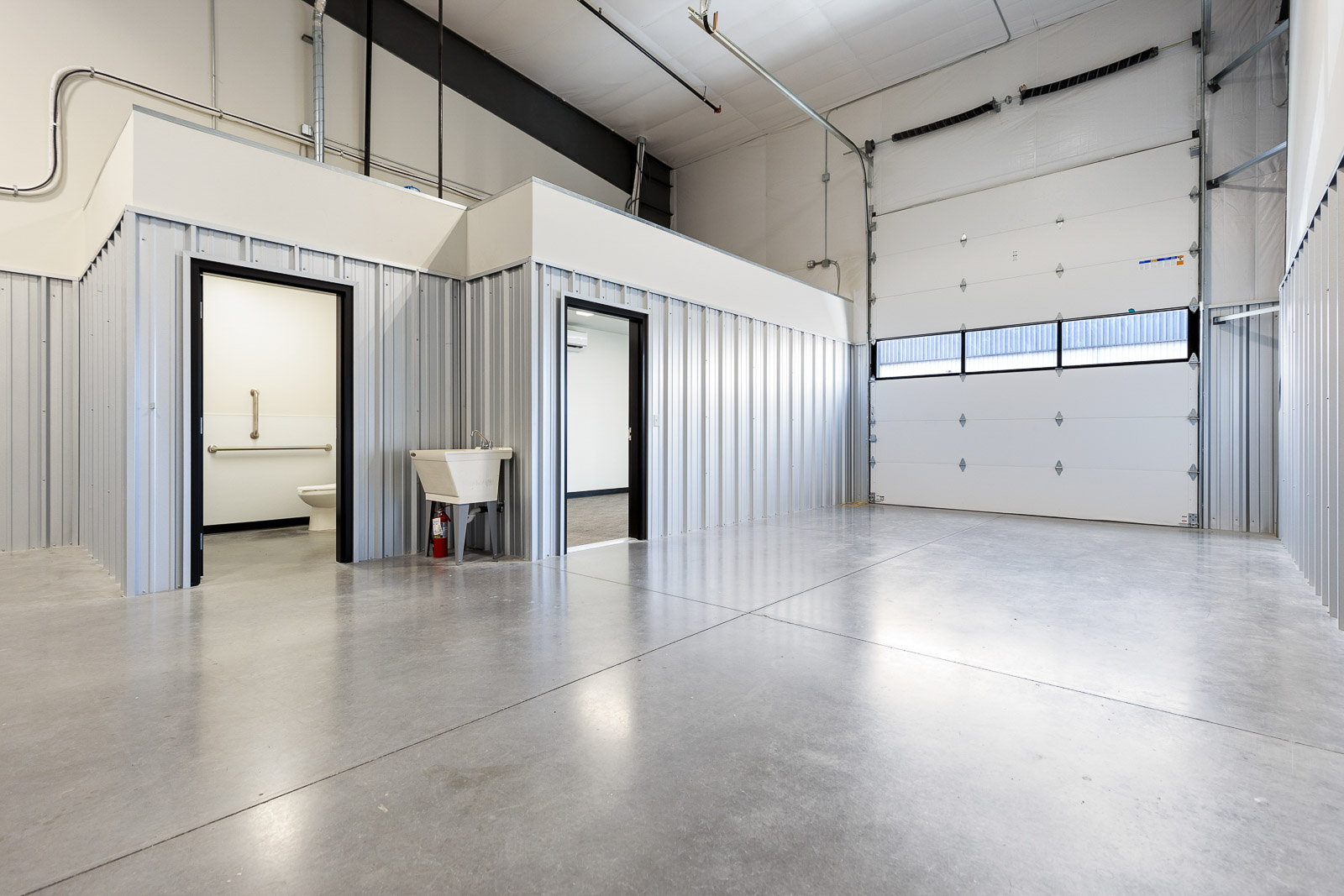 FlexSpace Business Centers in Richland showing a flex space with private restroom and large garage door.