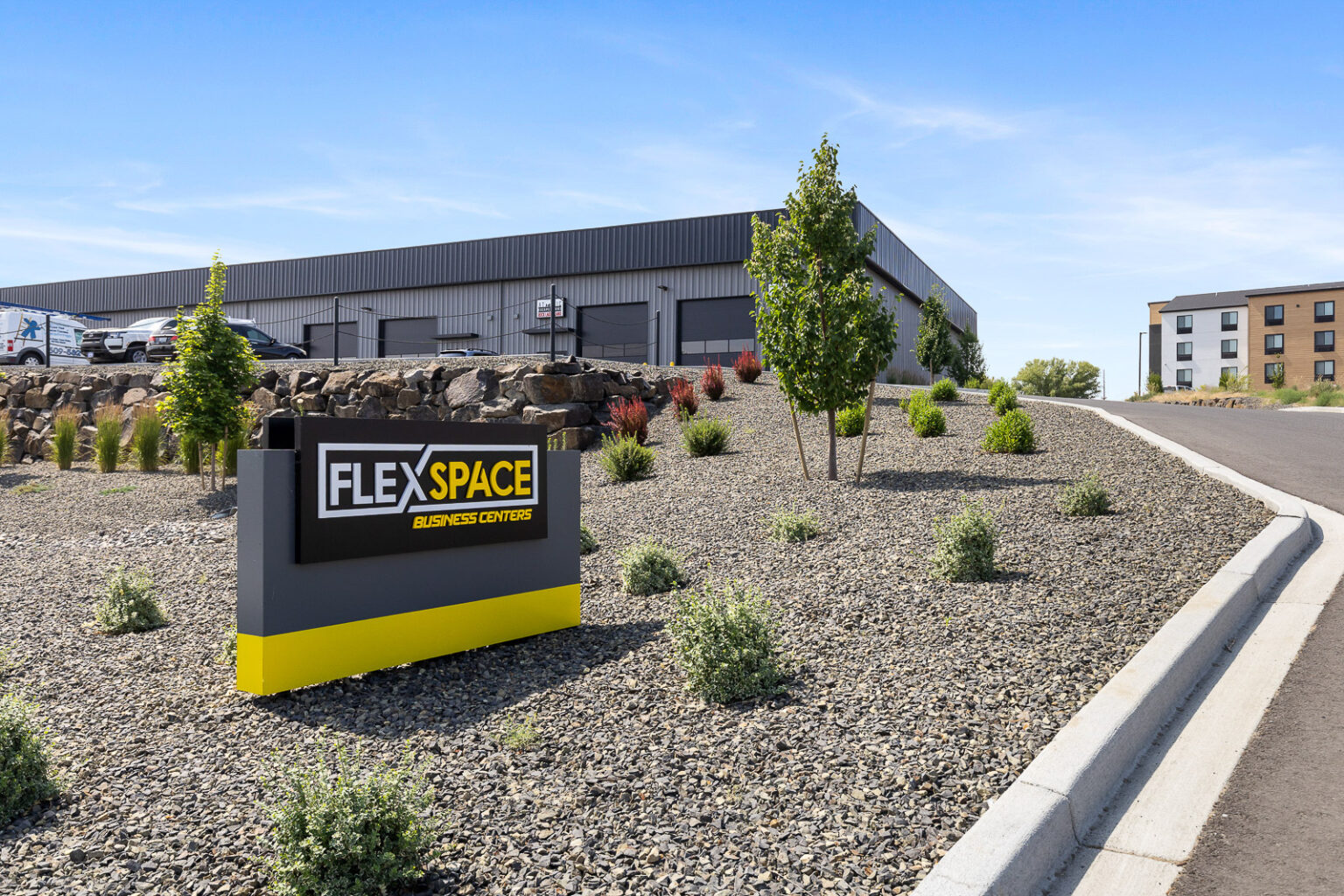 FlexSpace Business Centers Richland exterior with sign and landscaped entrance, great for commercial space Tri-Cities.