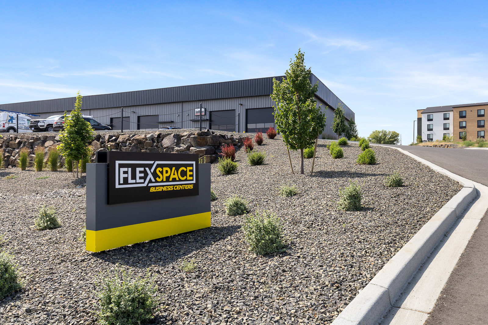 FlexSpace Business Centers Richland exterior with sign and landscaped entrance, great for commercial space Tri-Cities.