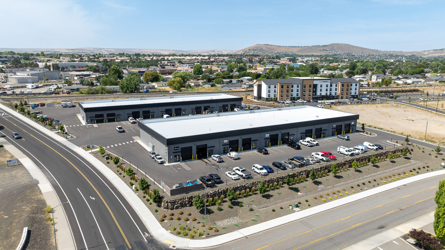 Aerial view of FlexSpace Business Centers on Tapteal Drive in Richland with parking lot and surrounding landscape.