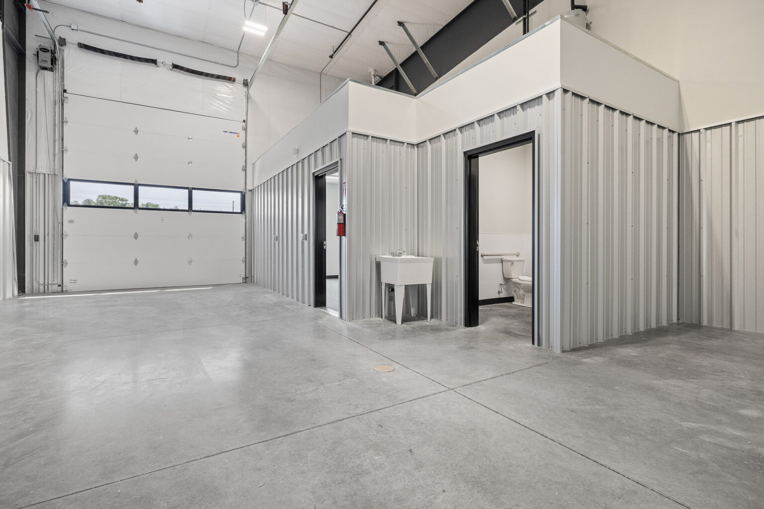 Warehouse unit with restroom and garage door at FlexSpace Business Centers in Richland.