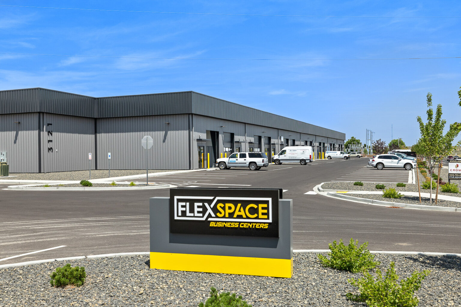 FlexSpace Business Centers Richland exterior at Leslie Road with parking area and company sign.