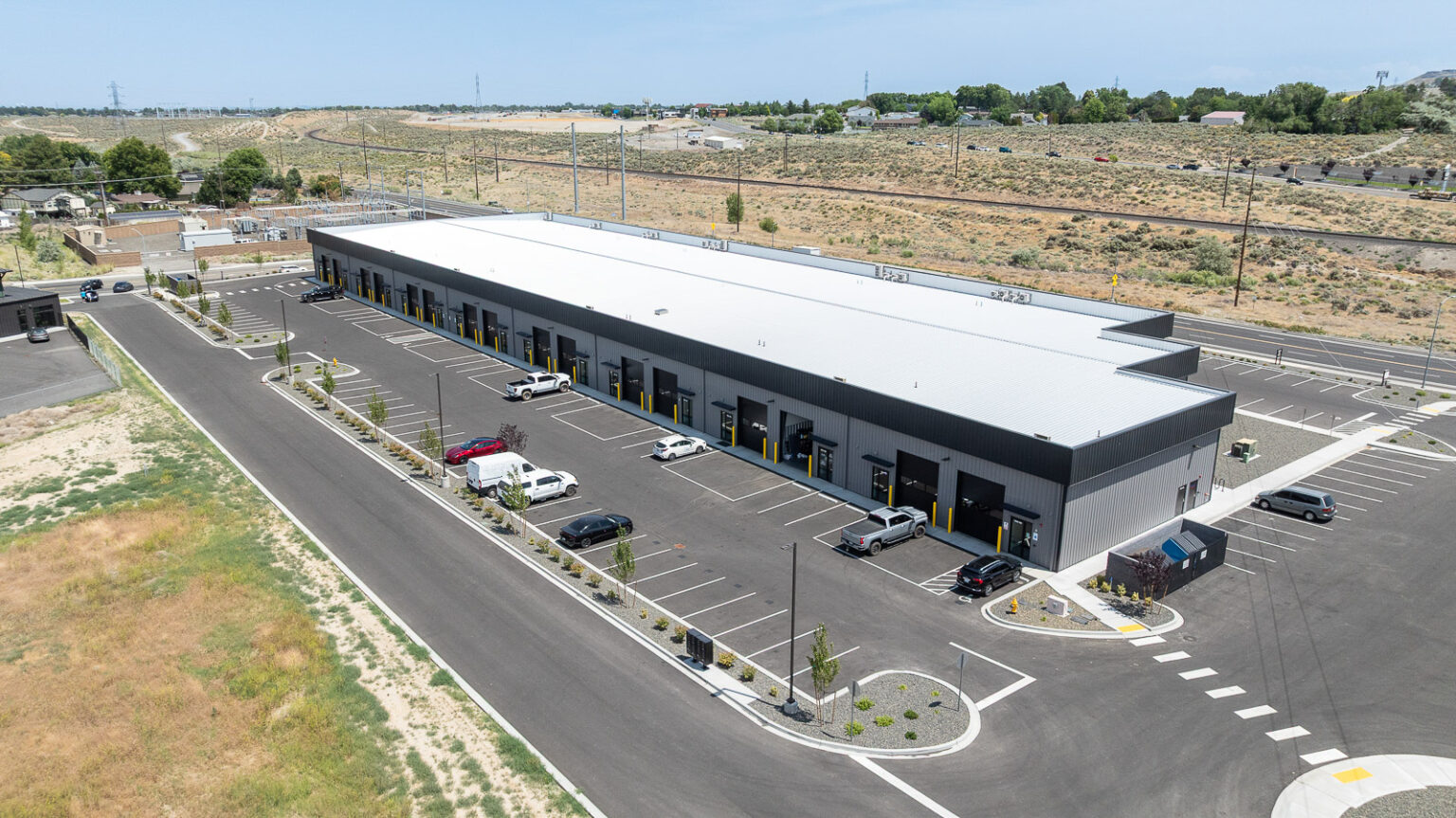 Aerial view of FlexSpace Business Centers showing large flex units in Richland with ample parking.