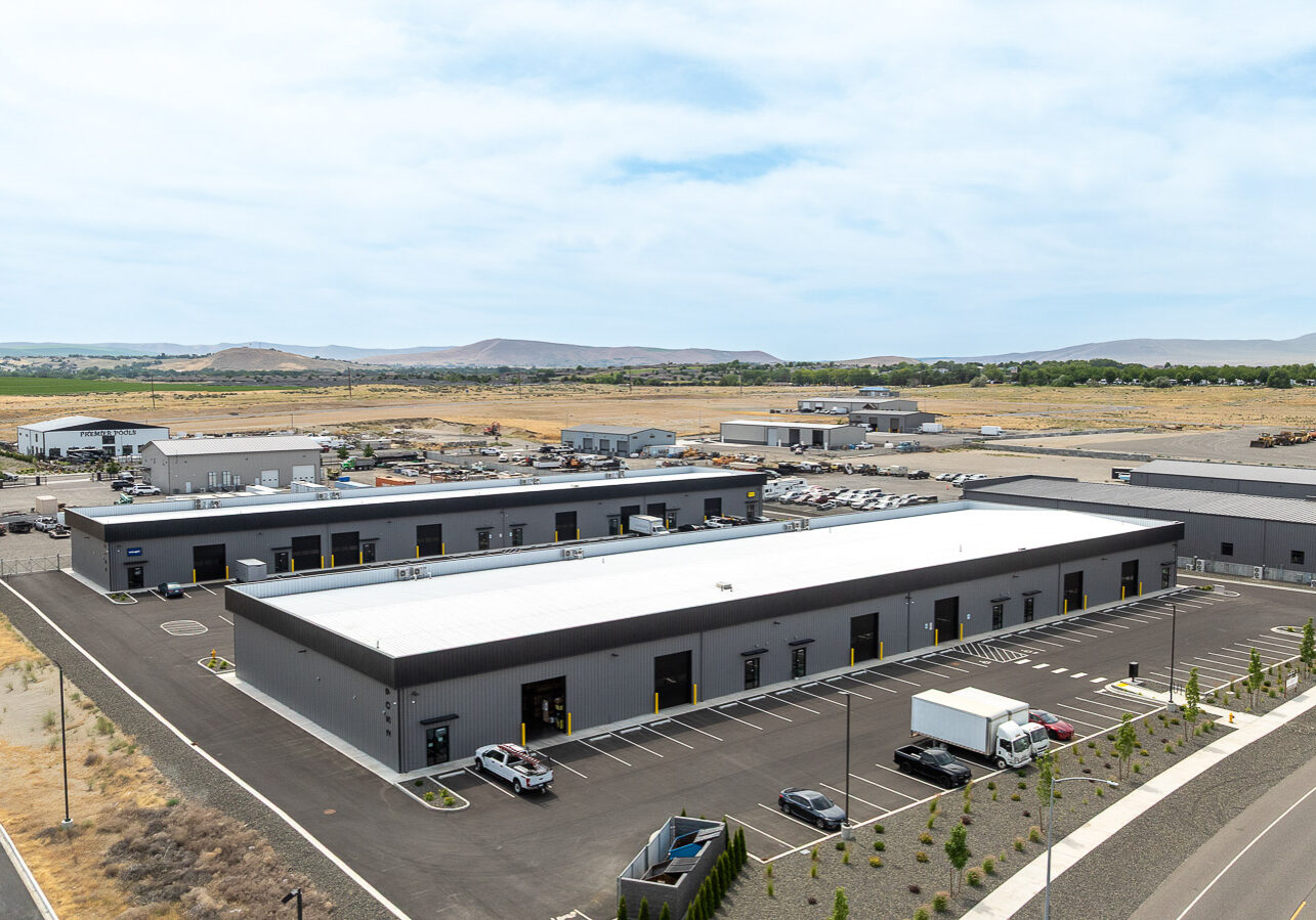Aerial view of FlexSpace Business Centers on Logan Street, showcasing large buildings with parking in Richland.